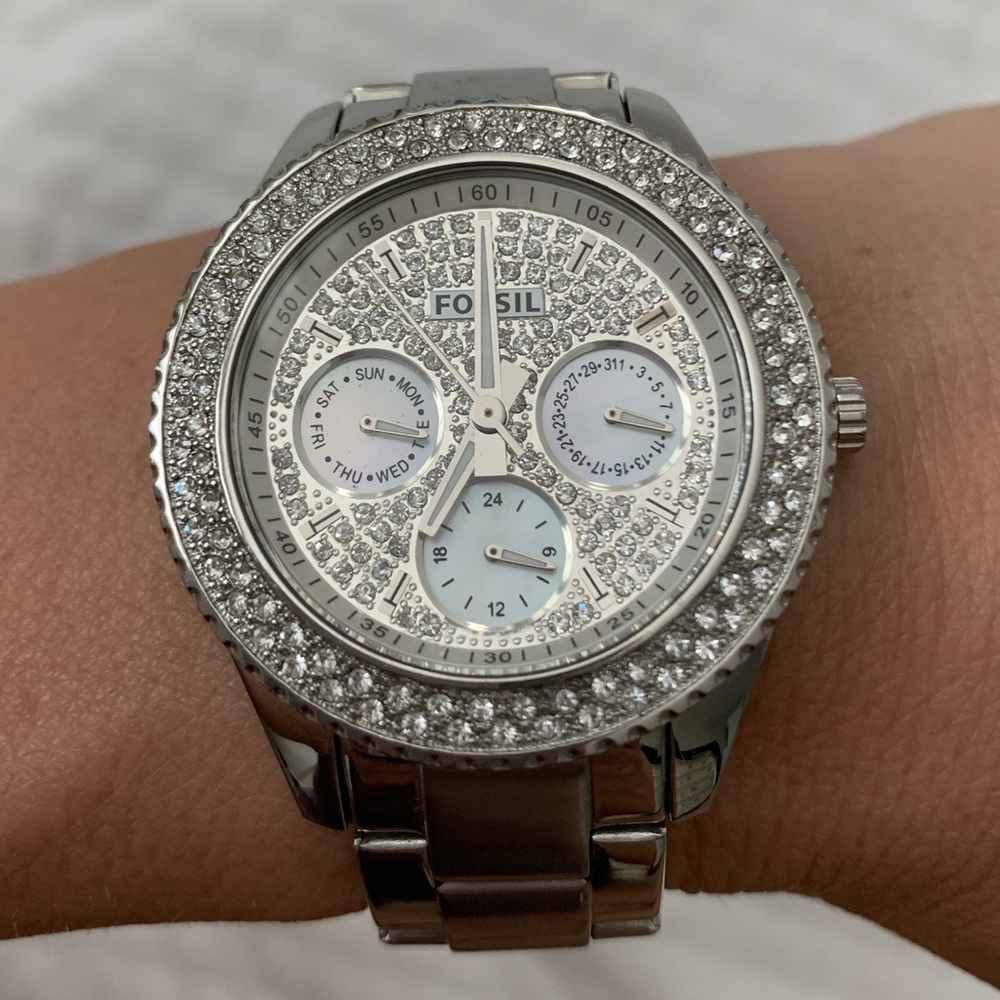 Women’s silver Fossil watch with crystal face